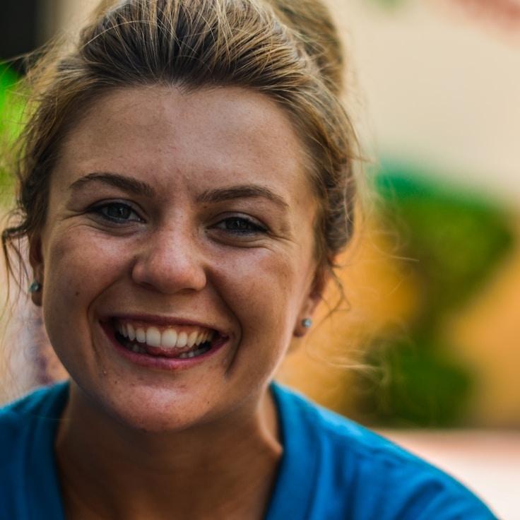 Asha Rao, Lead Design Curator at Mint Forest Nest, reviewing corporate floral arrangements